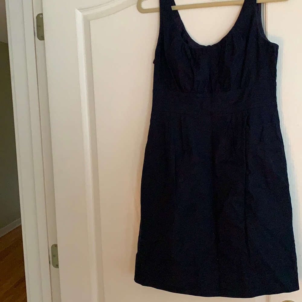 Navy sleeveless dress with cinched waist